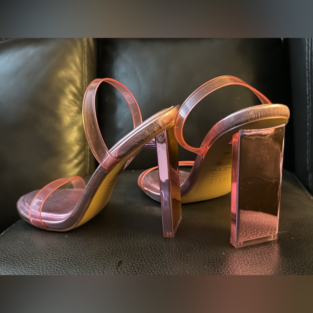 Selling this cute and unique pink heels as my feet turned wide.
